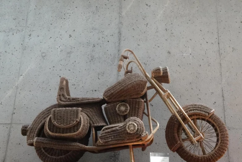 an unusual looking basket motorcycle sits in the street