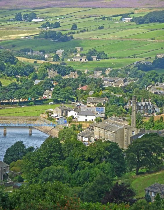 the town is nestled between some green hills