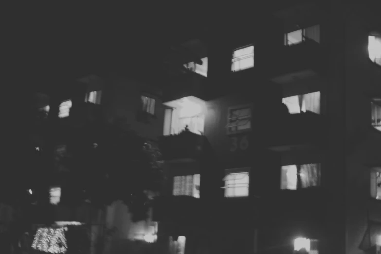a black and white picture of many windows