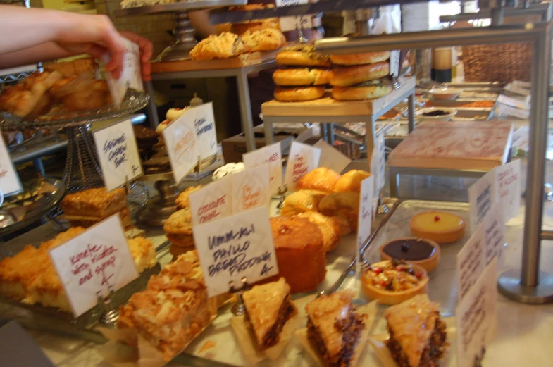 a display in a bakery filled with lots of food