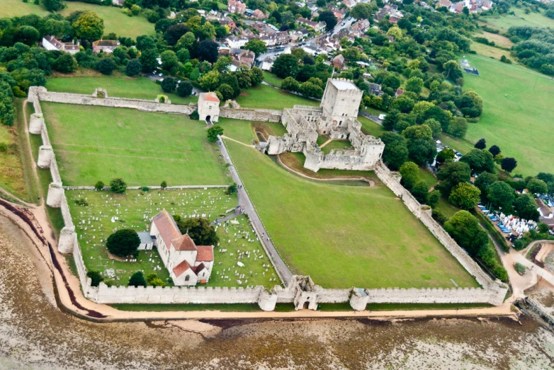 an aerial s of a castle, garden and river