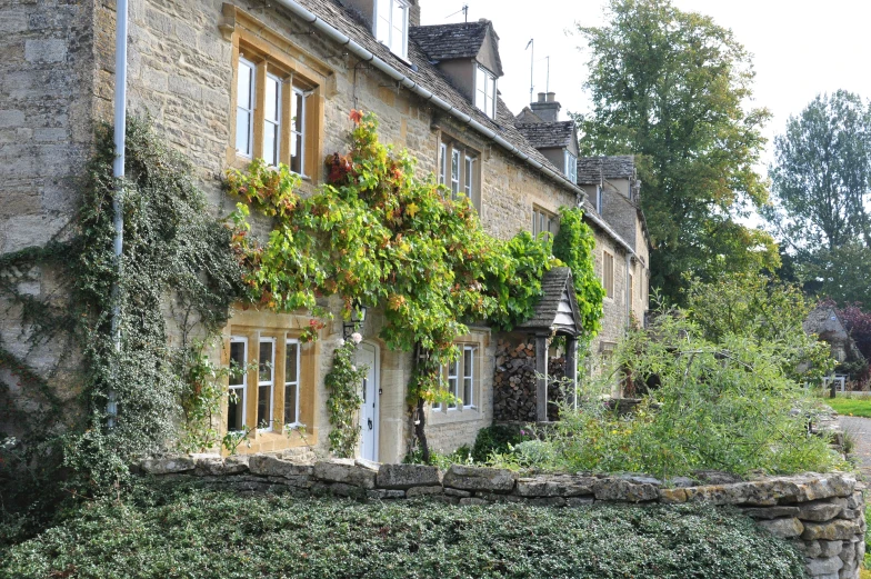 a stone building with ivy growing on it's side
