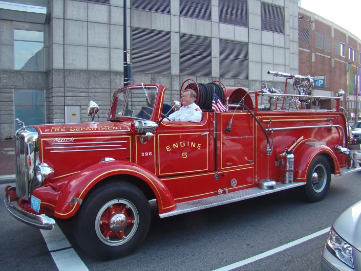 a fire truck with a man inside of it