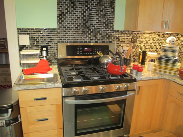 kitchen stove with various cooking utensils on it