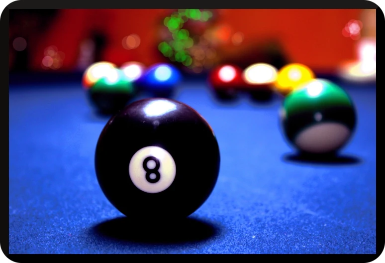 a pool ball is sitting on a blue table