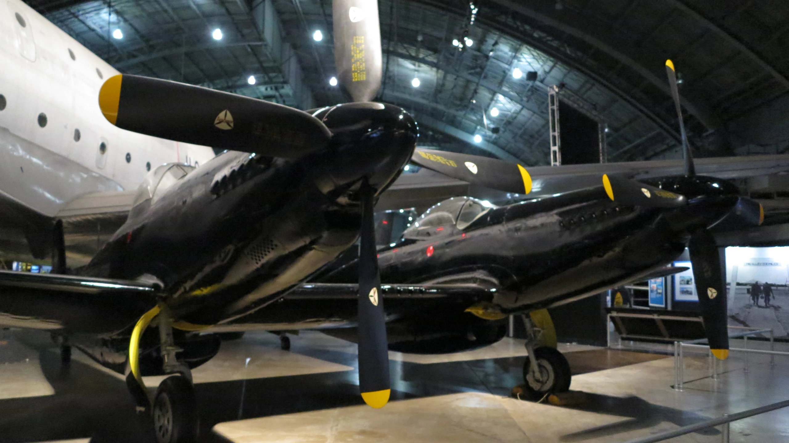 two planes that are parked in a hangar