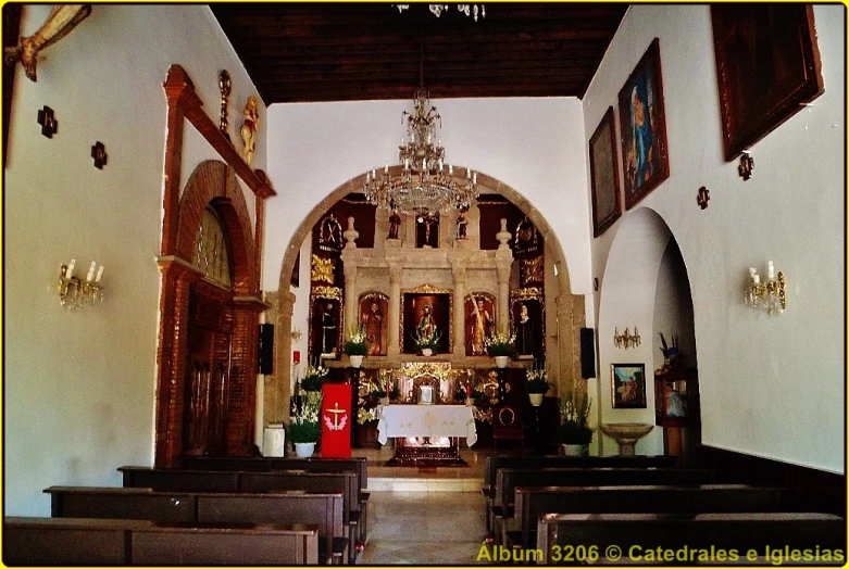 inside the church with several empty pews