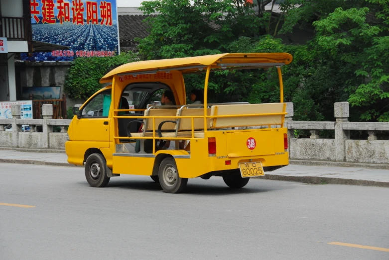 a yellow bus is parked on the side of the street