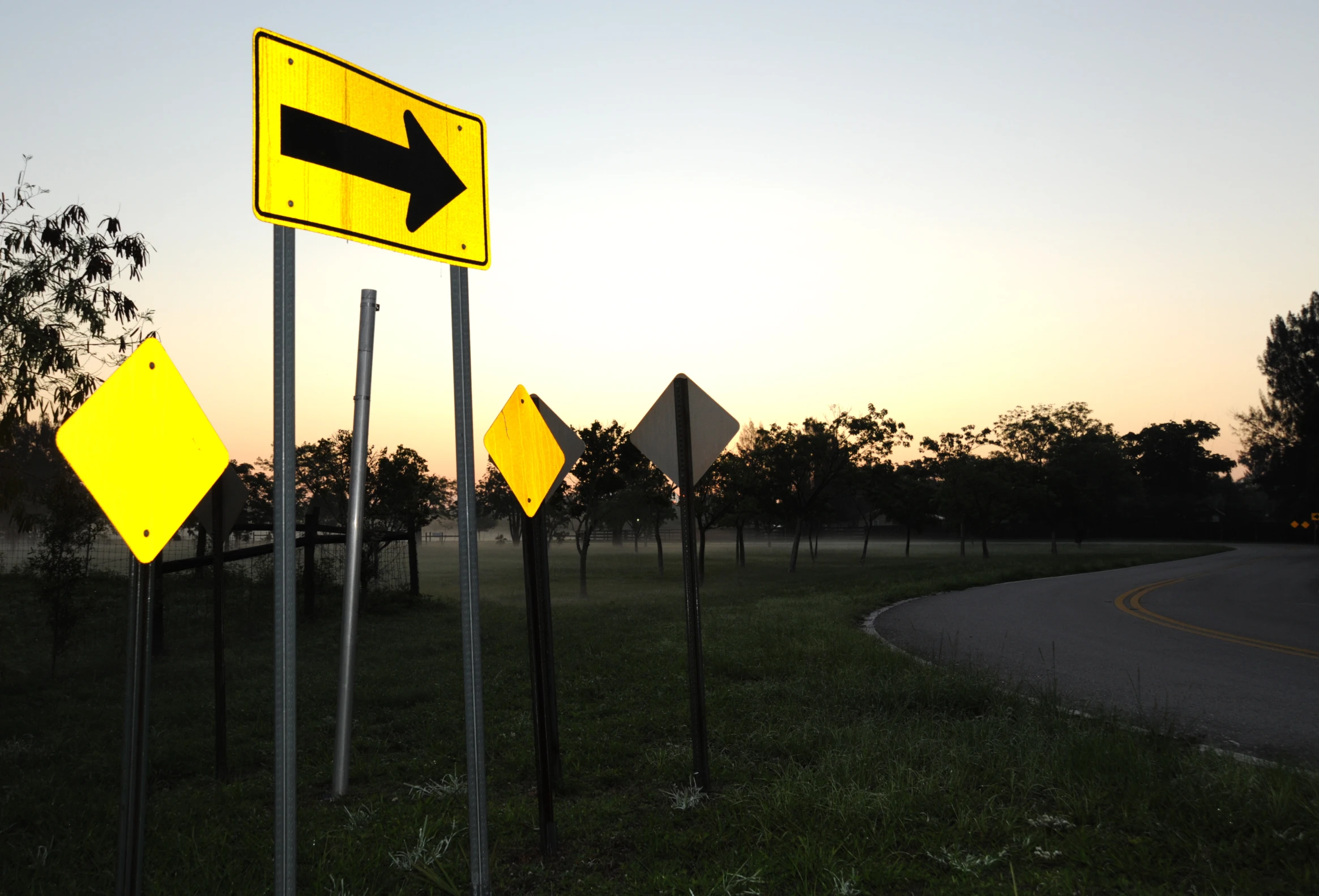 there are multiple street signs pointing to one way