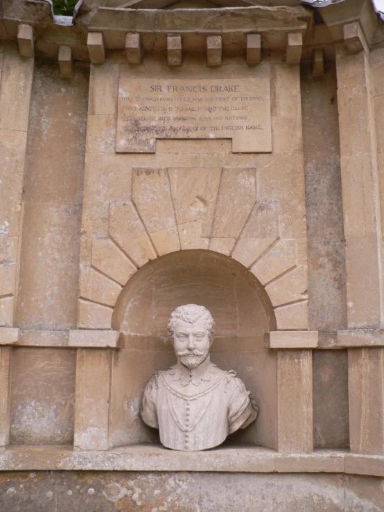 the statue is located on top of a wall