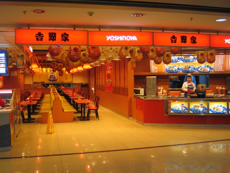 a restaurant with large display cases on the walls