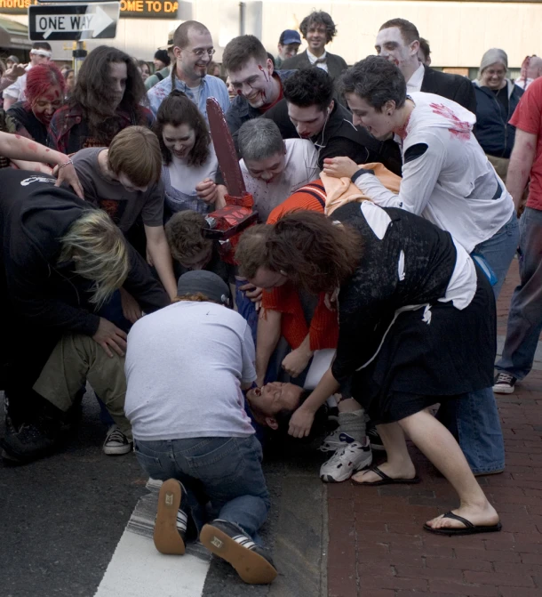 a group of people on the street in a pile