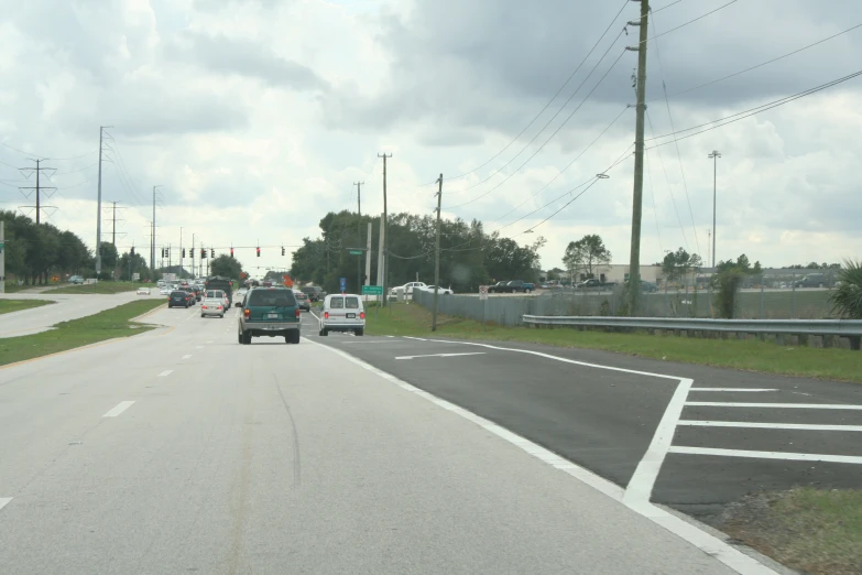 a truck coming down the highway near an intersection