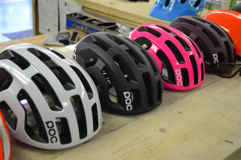 several different helmet shapes are displayed in the po