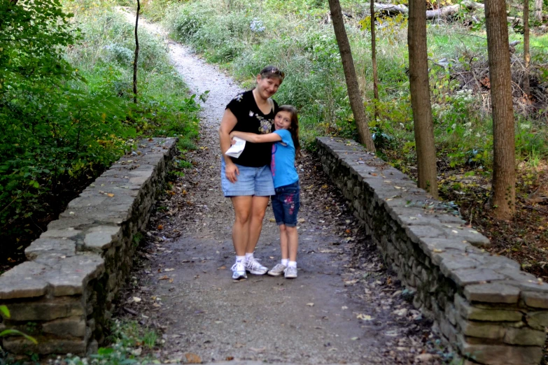 mother and baby in park setting on path