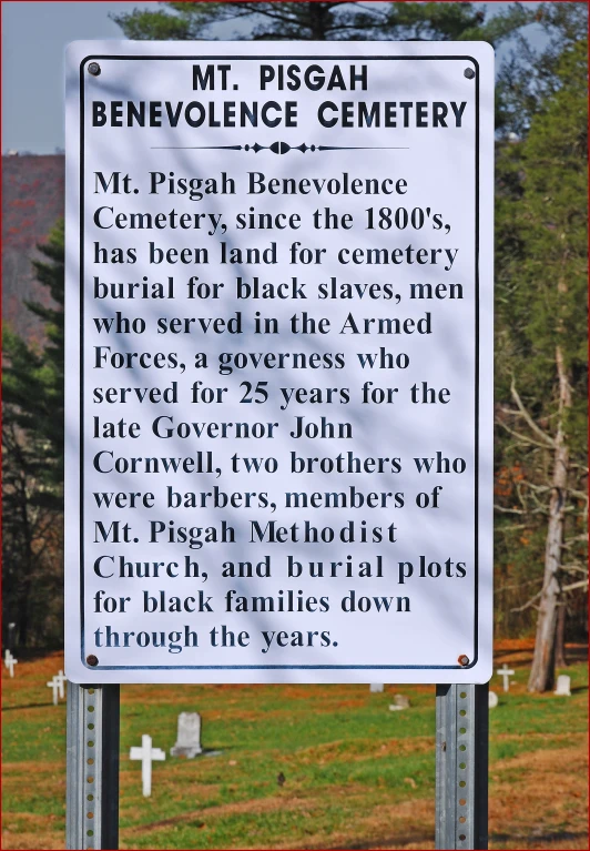 a white sign with black lettering that reads, mt picah benevole cemetery