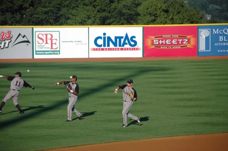 a couple of baseball players on a field