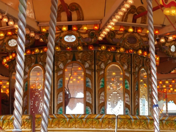 a carousel with two wooden horses on it