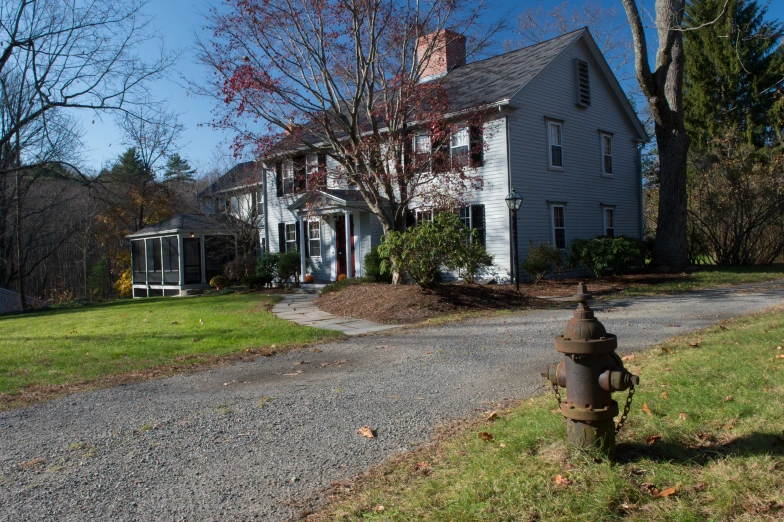 a fire hydrant next to a home and a driveway