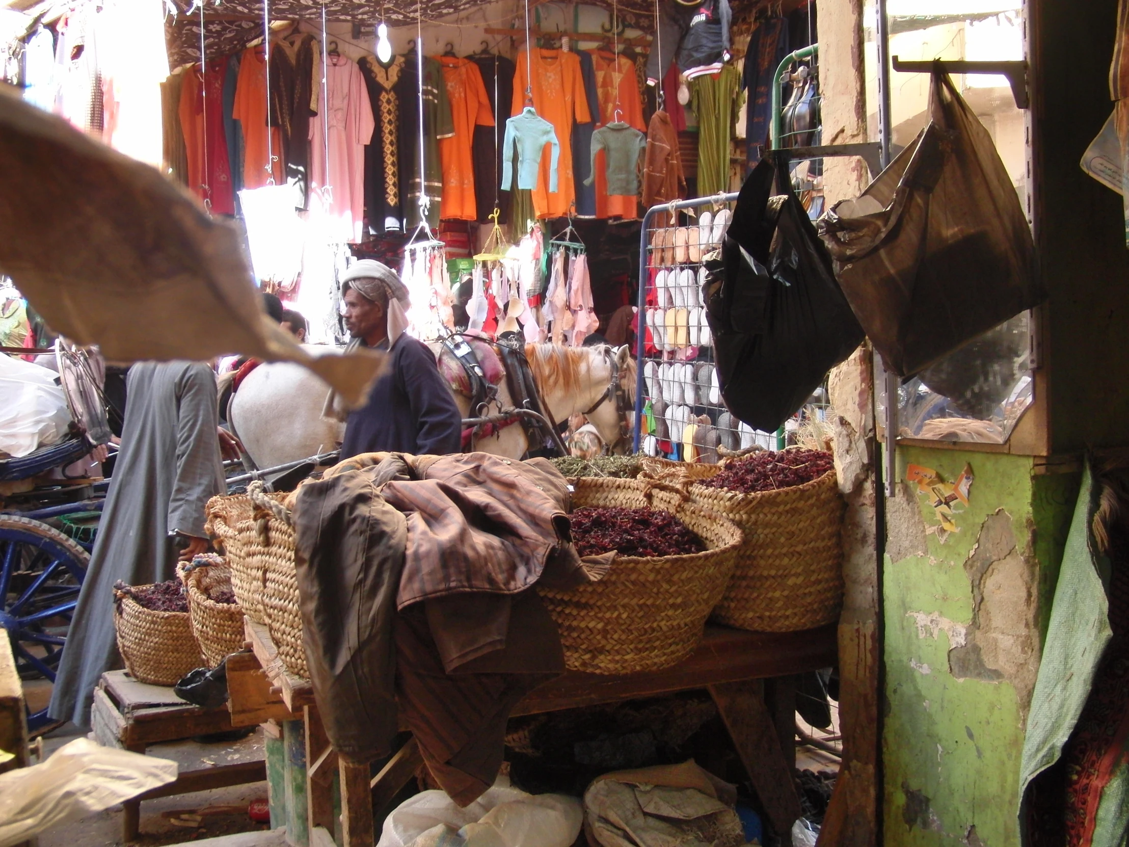 a man is shopping in an outdoor market