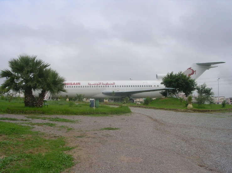 the large air plane is parked at the landing strip