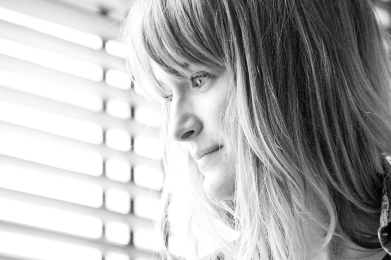 black and white portrait of a woman looking off into the distance