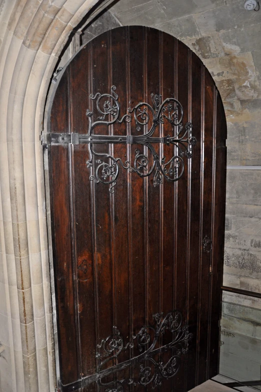 the wooden door has carvings in a pattern