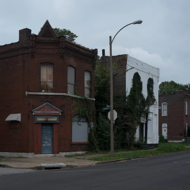 an old brick building in a street corner