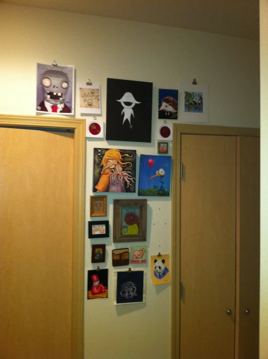 a picture of a wall with many pictures and decorations