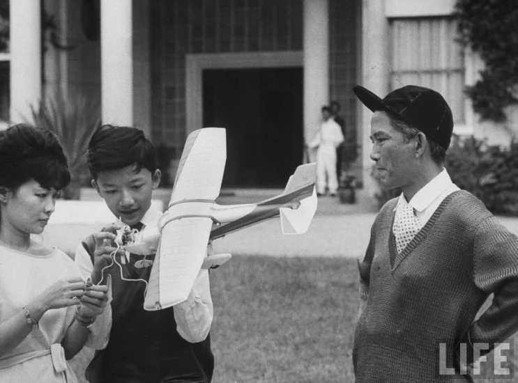 two young women standing beside a man and woman