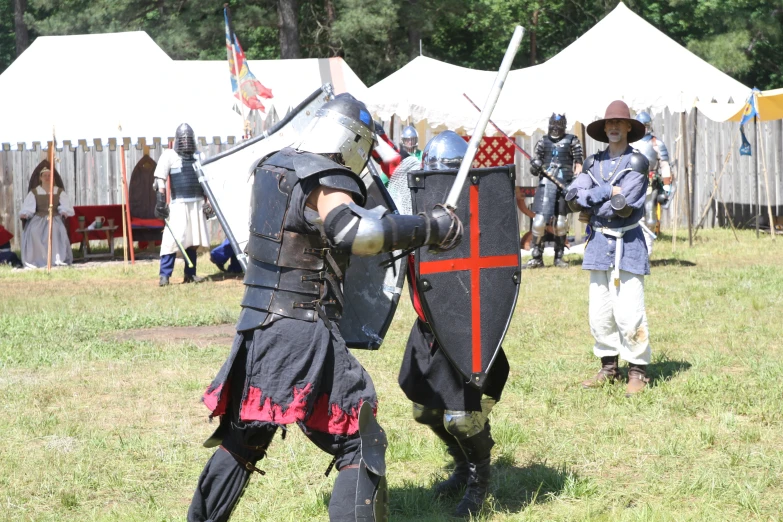 some people in medieval armor at an event