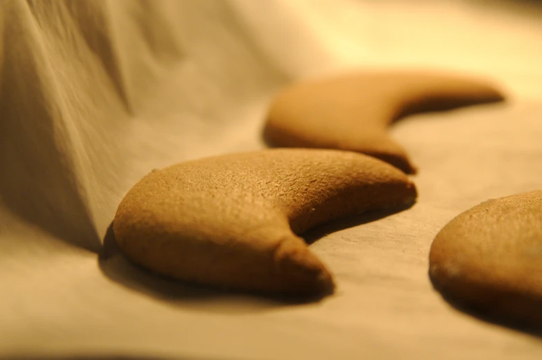 a number of cookies laying on top of a counter