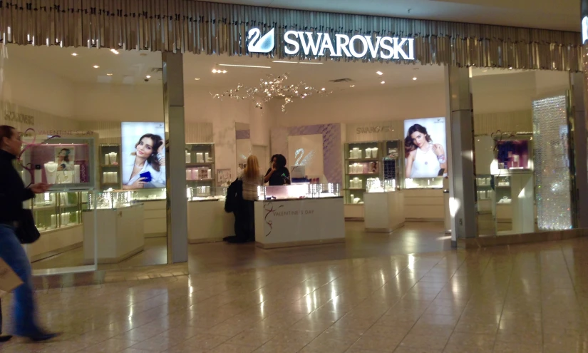 two woman standing inside a store looking at products