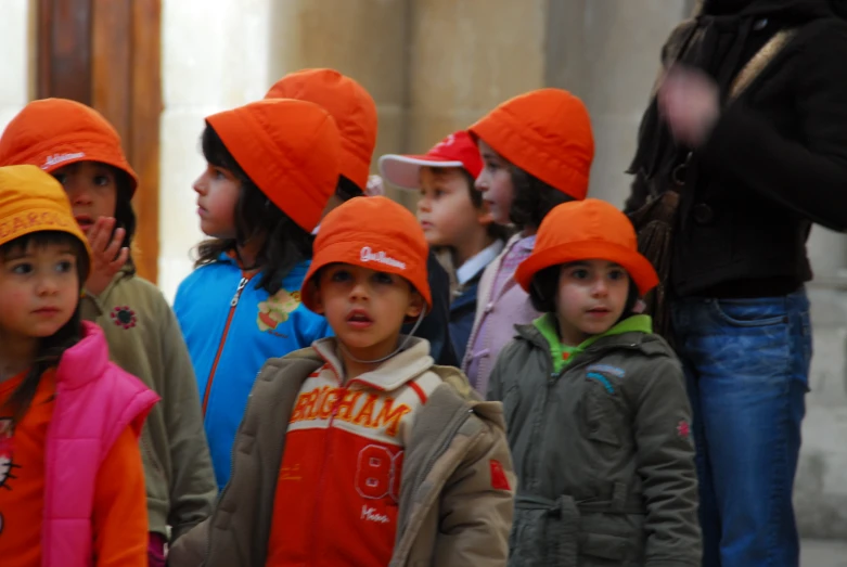 there are many little children with matching hats