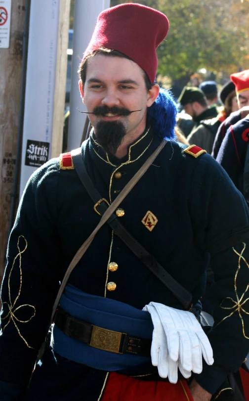 a man in uniform, dressed up for the day