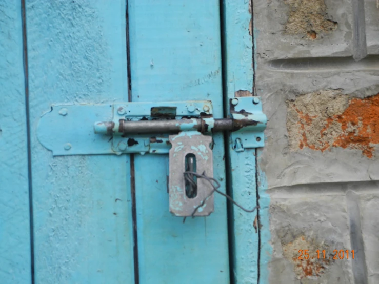 a light blue door that has an opening