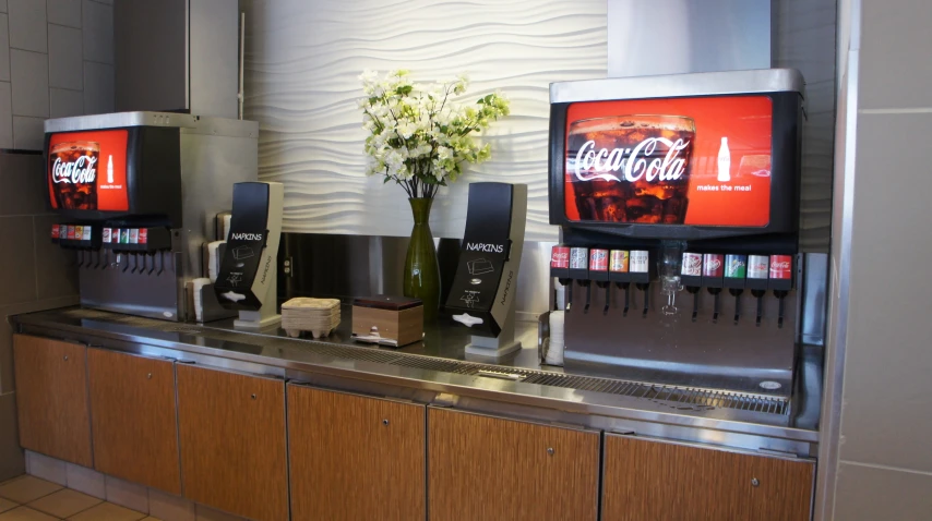 coke machines line the counter of a small restaurant