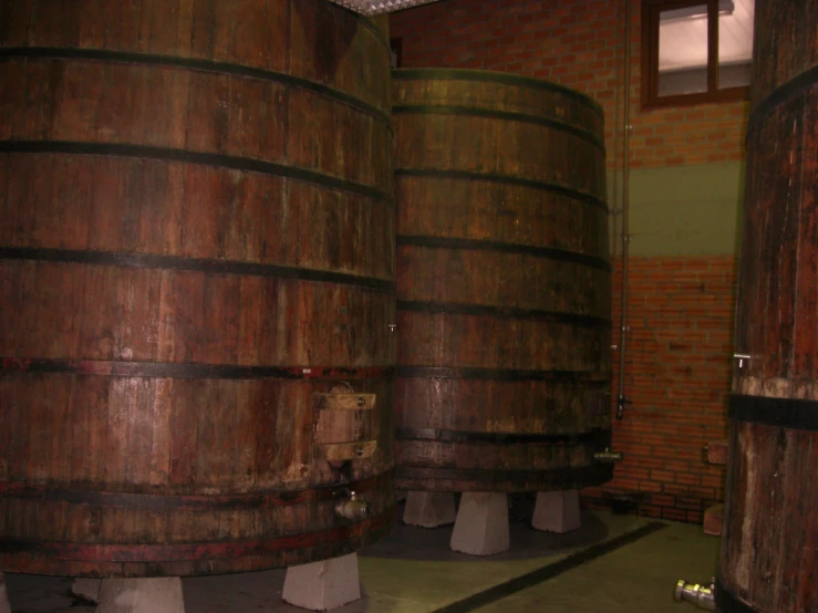 a couple of big wooden barrels in a room