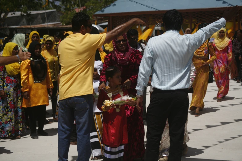 the group of people are wearing colorful attire