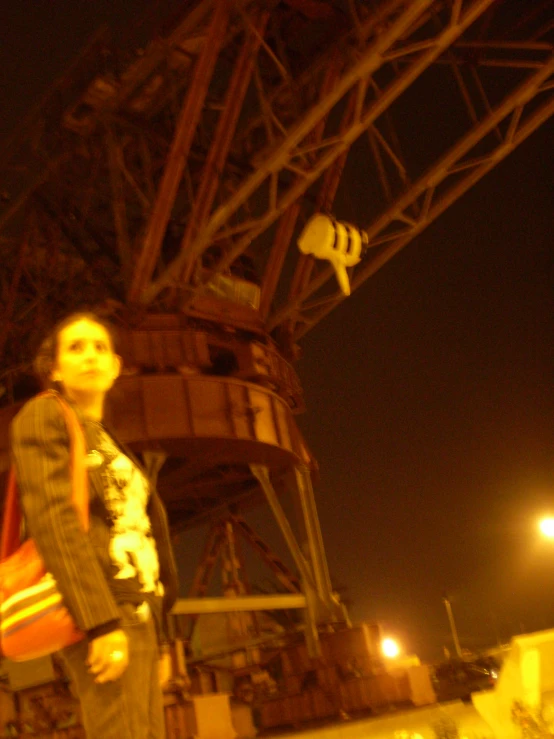 a person holding a handbag near the eiffel tower