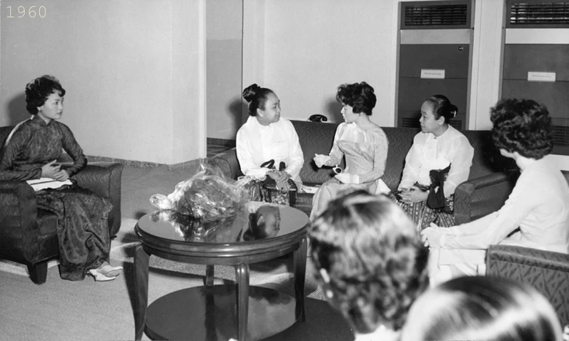 a group of women sitting in a living room