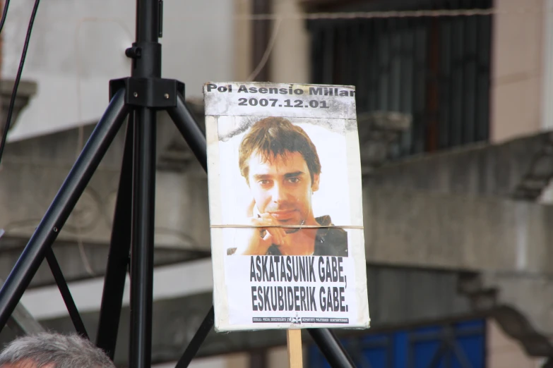 a close up of a protest sign with an advertit