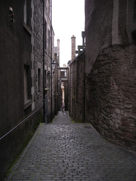 a stone road with buildings on both sides