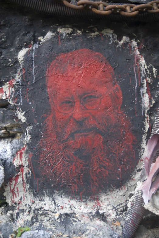 a graffiti image of a bearded man with a red beard