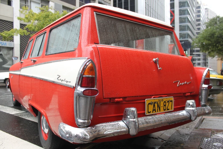 a red car parked on a city street