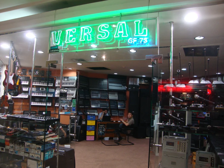 a store is full of electronic devices and musical equipment