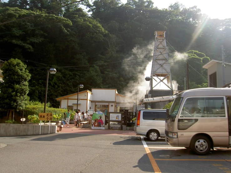 the camper is parked in a lot and smoke coming from it