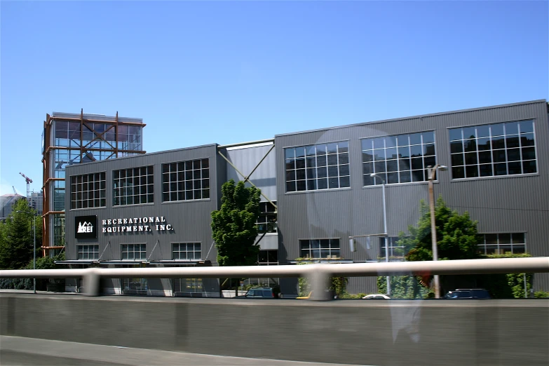 a truck moving past a building on a freeway