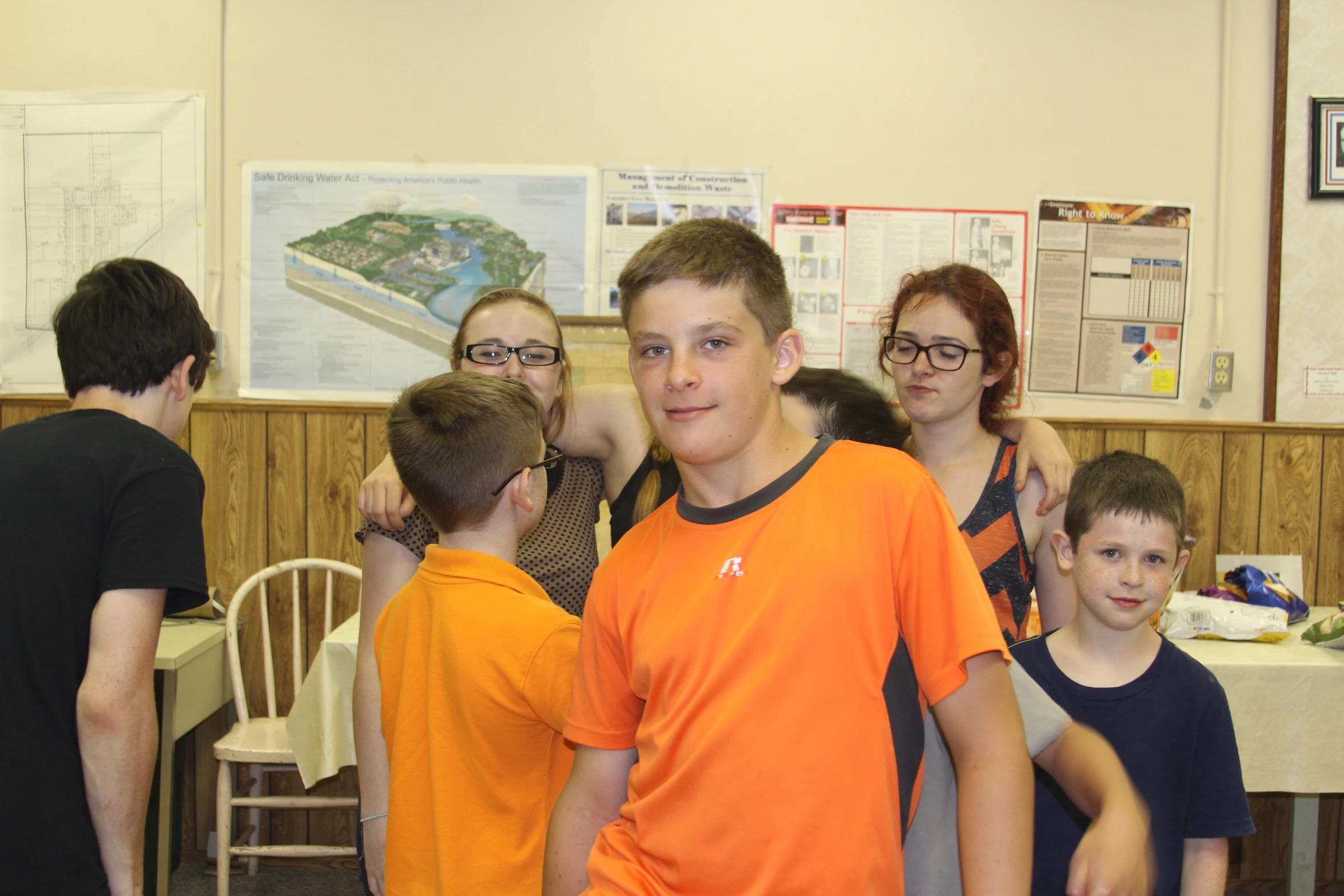 young children and adult at a school cafeteria