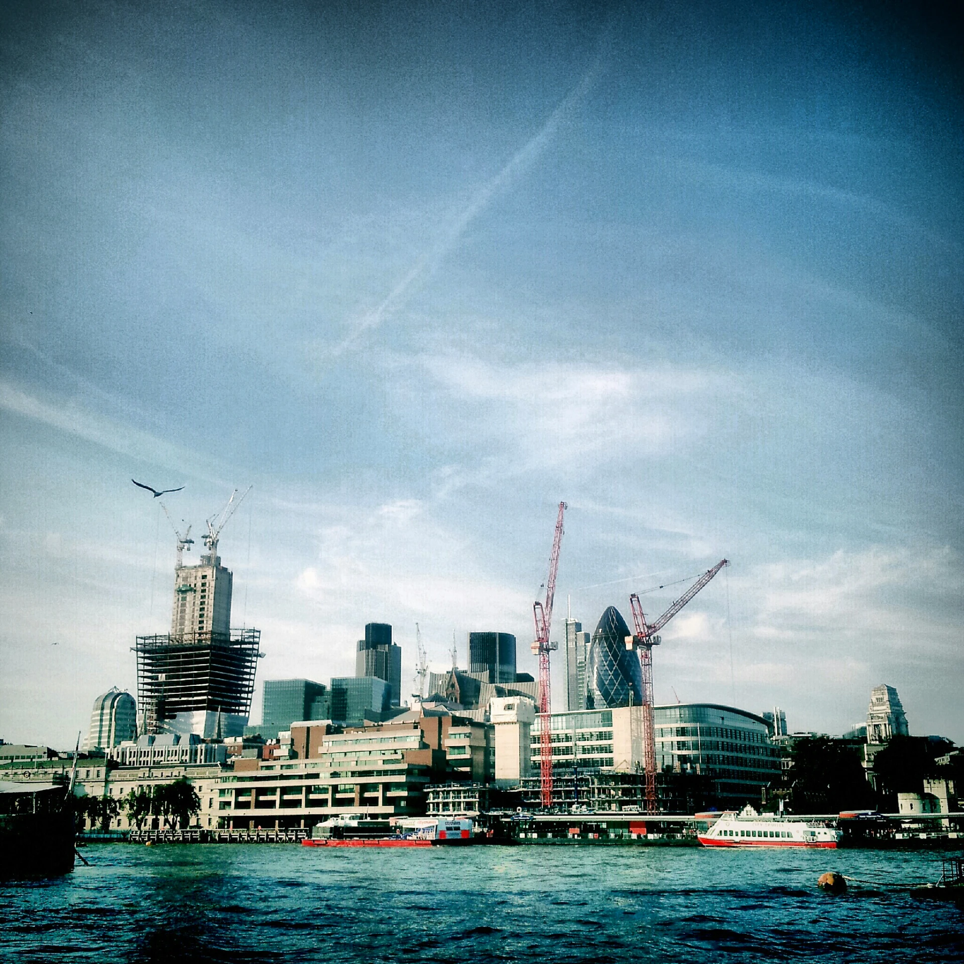 a city skyline is shown on a bright sunny day